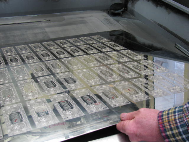 A $1 note 50-subject plate is prepared for cleaning.